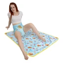 Female model sitting on the absorbent Lunar Cub change pad.