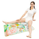 Female model sitting on the absorbent Barnyard change pad.