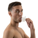 Male model using Gummi Pacifier, side-view.
