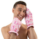 Male model wearing mittens and holding hands to his face.