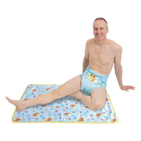 Male model sitting on waterproof change pad.