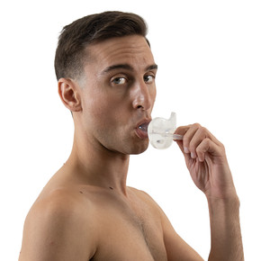 Male model using Gummi Pacifier, side-view.