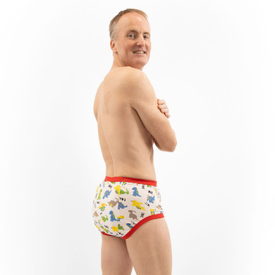 Male model wearing Dinosaur training pants, side-view.