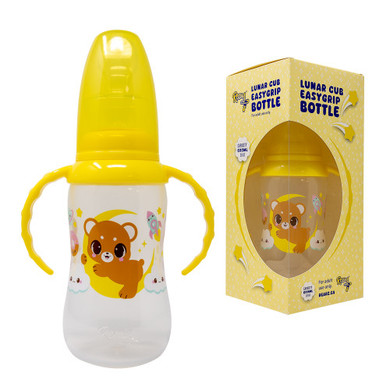 Lunar Cub adult bottle with dust cover beside box with bottle inside.
