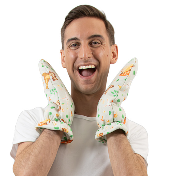 Male model wearing Padded Mittens with hands held near face.