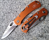 Buck 722 SpitFire - Satin 420HC Drop Point Hollow Ground Blade - Orange Aluminum Handle Scales w/ Gray Back Spacer - Four-Position Reversible Pocket Clip - Lockback Manual w/ Thumb Hole | Made in USA