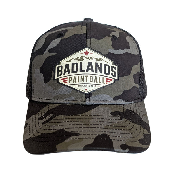Badlands Paintball camo trucker hat with mountain logo patch front view