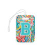 Front of personalized suitcase tags with the letter B atop a bright, tropical print