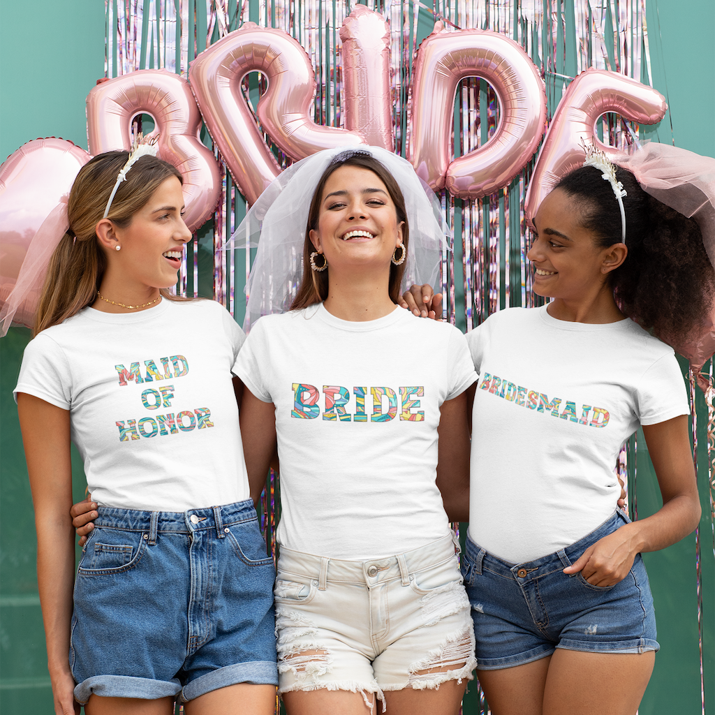 3 smiling women: Bride custom tee and bridesmaid t-shirts in tropical lettering