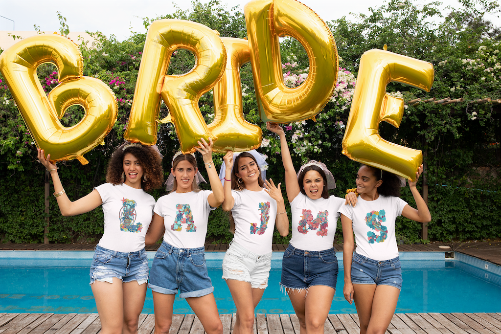 bridesmaids and bride in matching monogrammed tees by saltsy