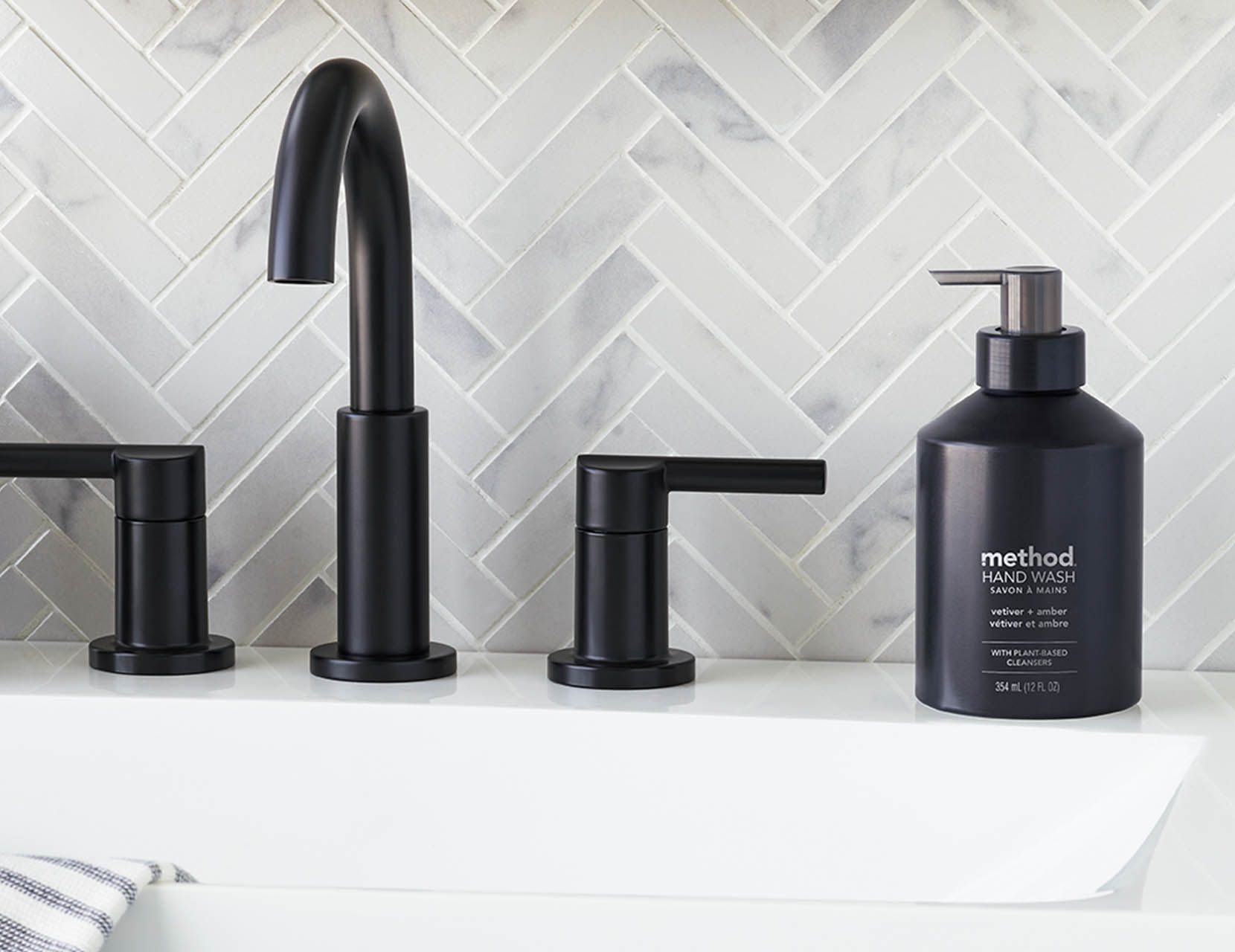 Washing hands with Method aluminum Vanilla + Raspberry soap