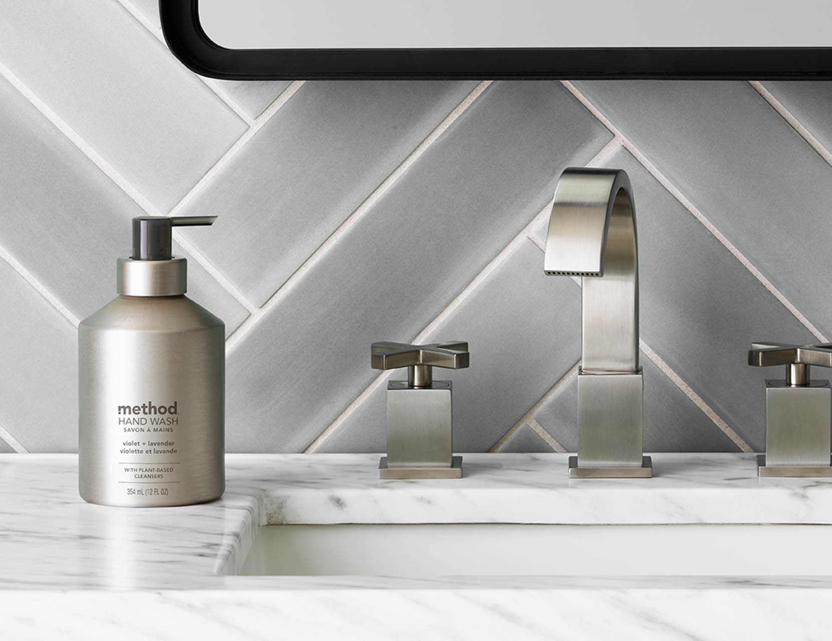Washing hands with Method aluminum Vanilla + Raspberry soap