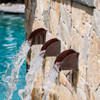 Bobe Radius Scupper: As shown copper patina radius scuppers with water spilling into pool