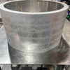 Round raised open bottom aluminum garden bed.