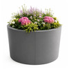 Round modular aluminum raised open bottom planter. Ash shown with powder coated Charcoal Gray Finish