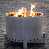 The Outdoor Plus Round Smokeless Gravity Fire Pit. As shown wood burring in raw corten steel finish. 