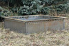 Square smokeless steel fire pit insert with 3 inch flange resting on ground outdoors