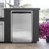 The Outdoor Plus Videl USA Compact Outdoor Refrigerator, stainless steel outdoor fridge in a modern outdoor kitchen with pink flowers