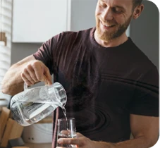 man pouring water