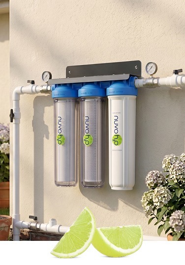 NuvoH2O system installed on exterior wall with fresh lemons