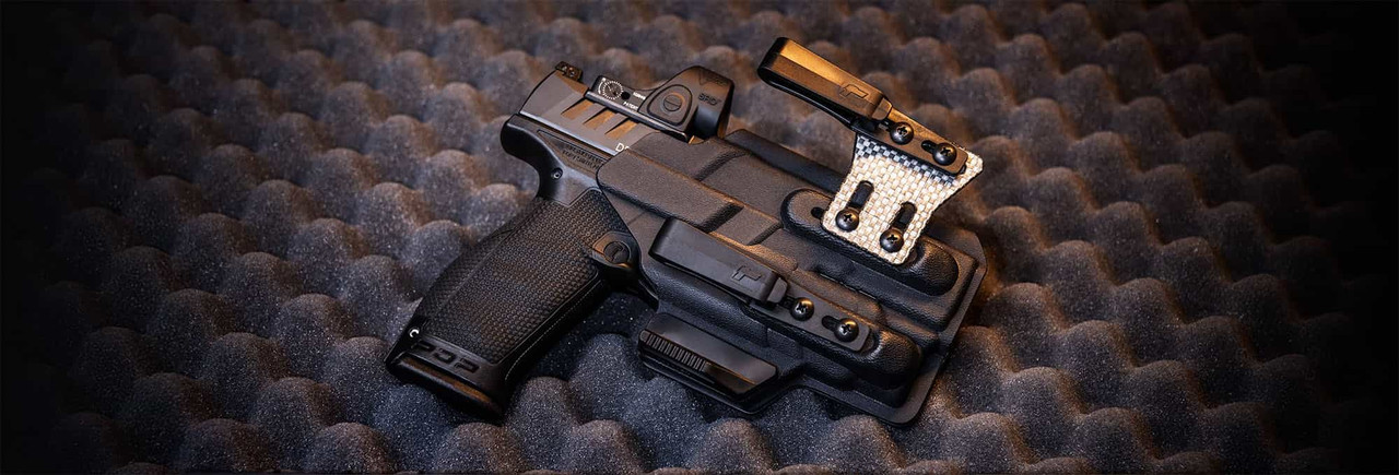 Walther PDP full-size pistol with a TLR-7 tactical light holstered in a Tulster Arc minimalist holster, showcasing a sleek and reliable everyday carry setup.
