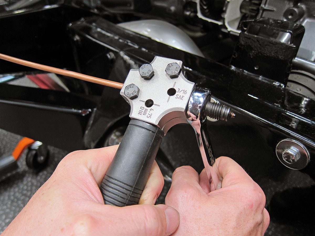 Hand-held brake pipe flaring tool designed for on or off vehicle use, ideal for restricted areas.