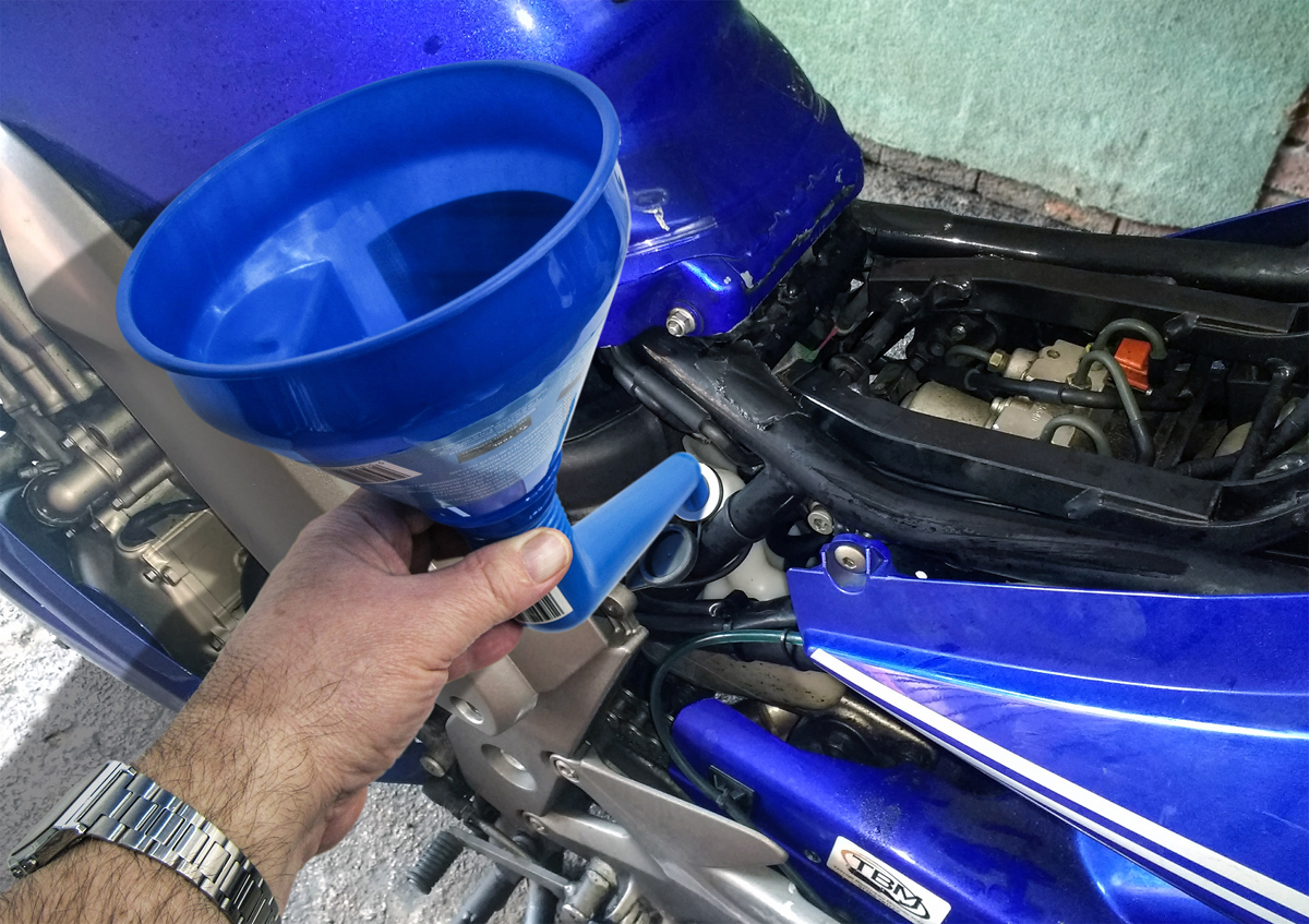 Angled access spout can be removed for straight funnel use as well as easy storage.