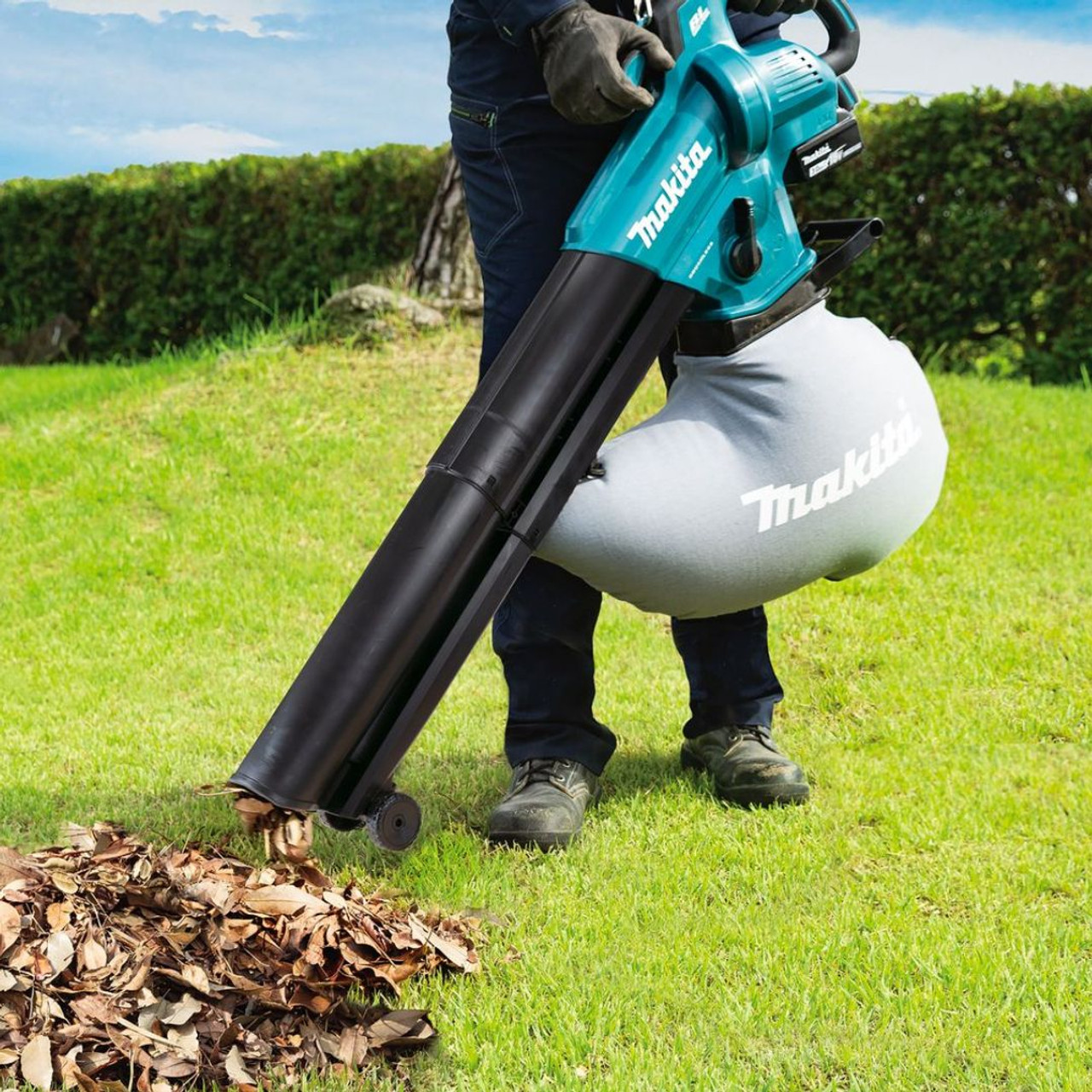 Cordless Leaf Blower Vacuum with convenient shoulder strap and front wheels.