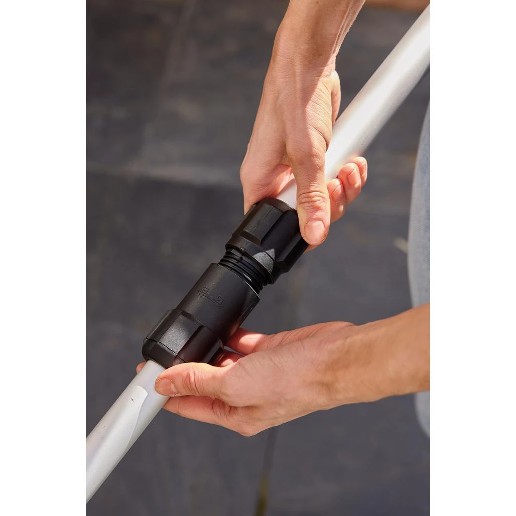The ergonomically designed handle, complemented by an adjustable auxiliary grip, ensures comfortable and precise weeding
