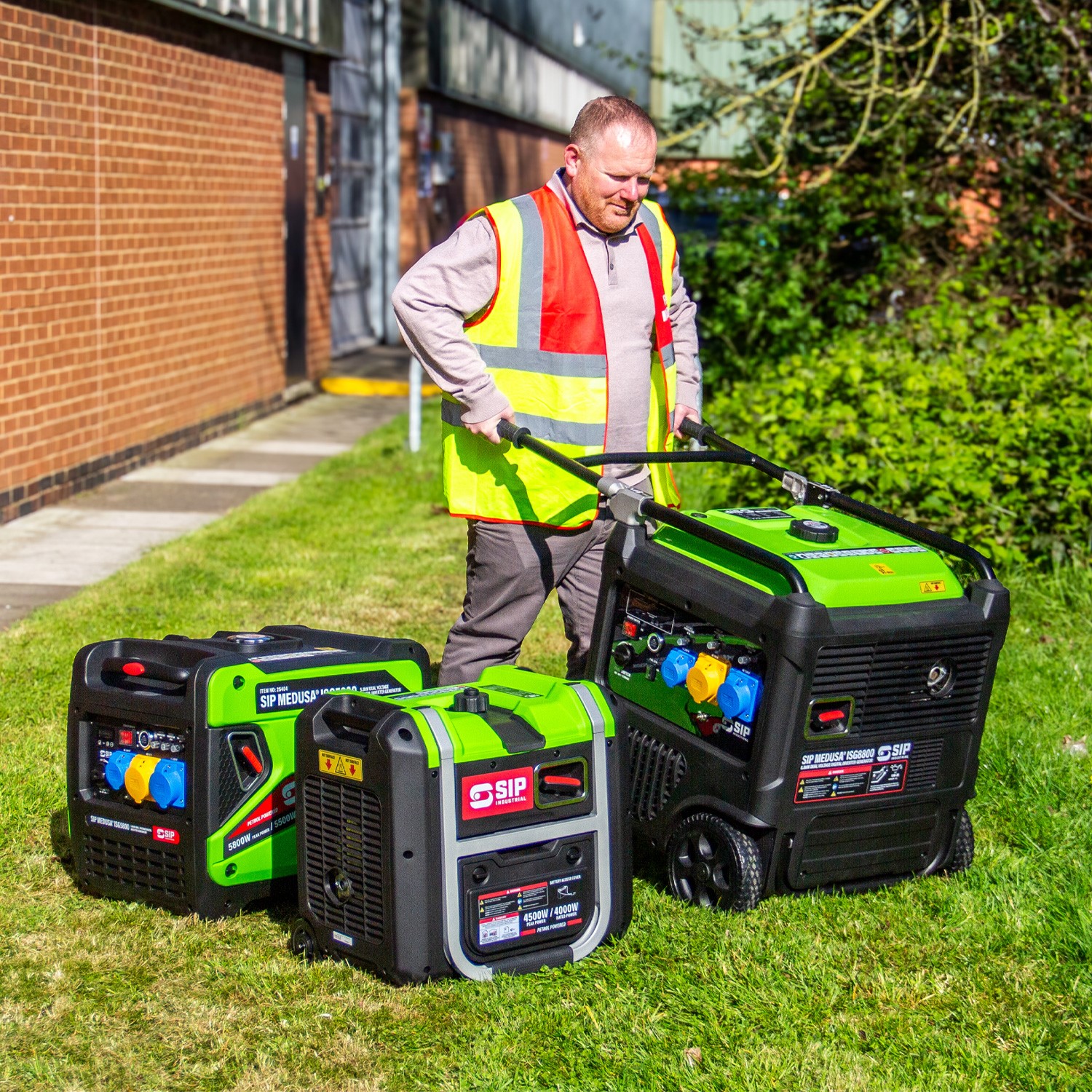 User wheeling the SIP ISG4500 generator outdoors using the integrated folding handle and wheels