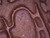 A microscopic view revealing the natural texture, mineral particles, and unique structure of authentic Yixing Zisha clay. This close-up showcases the natural characteristics of the clay material used in handmade teapot craftsmanship.