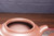 A close-up detail of the inner spout structure and water outlet of a handmade Yixing Zisha teapot. The refined interior craftsmanship reflects the precision and attention to detail of traditional Yixing teapot making.
