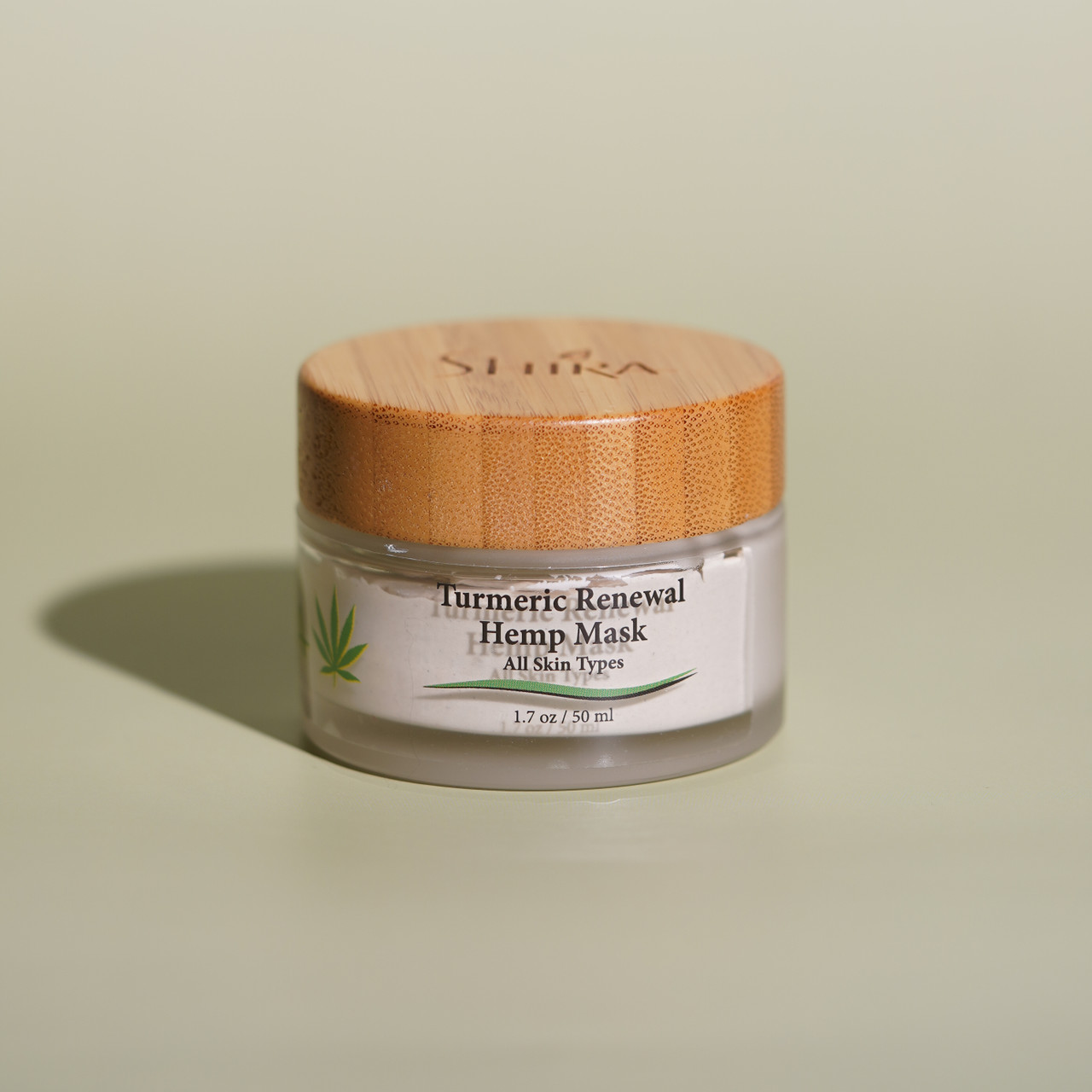 Shira Hemp Turmeric Renewal Mask Green Background