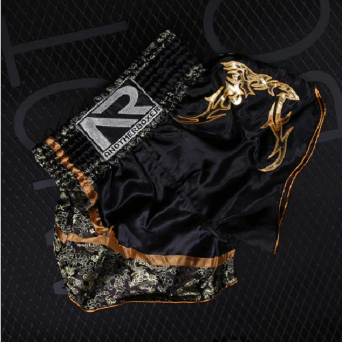 Get ready for your next fight with Another Boxer Muay Thai training shorts made of soft and breathable satin polyester. Perfect for men, women, and kids.