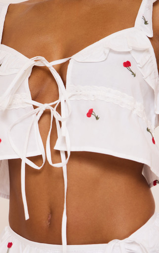 【cherry】THE TOE♡korinthos sleeveless Sleeveless Tie Front Embroidered Cherry Frill Top In White | EGO