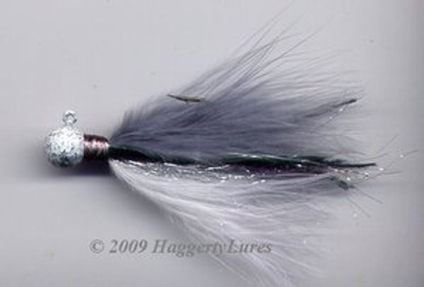 Gray Shad Marabou jig. Gray and white feathers with white silver vein head, silver flash and a lateral line.