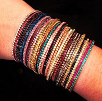 Assorted Rainbow Stack of 18 1 Line Crystal Wrap Bracelets Shown on Arm