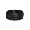 Black annealed box wire coil bundled and secured for industrial packaging