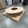 60" OD x 20" ID Kraft vapor barrier donuts stacked on a pallet in warehouse