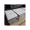 Fiberglass scrim reinforced kraft paper sheets protecting stacked metal products on a pallet