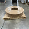 Front view of stacked 70" OD x 20" ID Kraft vapor barrier donuts on wooden pallet
