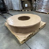 Angled view of stacked Kraft vapor barrier donuts with 70" outer diameter and 20" inner diameter