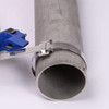 Stainless steel strapping tool tightening a metal band around a round pipe with stainless steel buckle