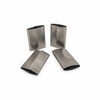 Four heavy-duty closed steel strapping seals displayed from multiple angles