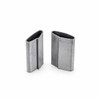 Two regular-duty closed steel strapping seals standing upright to show the open ends and overlapping seams