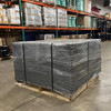 Front view of palletized material secured using plastic coil separators and strapping