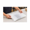 Worker enclosing an electronic keyboard in a white PE foam protective pouch