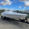 White boat shrink wrap protecting a trailered boat during winter storage and transportation