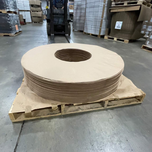 60" OD x 20" ID Kraft vapor barrier donuts stacked on pallet with center opening visible