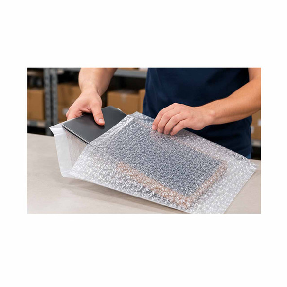 Worker placing an electronic device into a self-seal bubble pouch for protective packaging